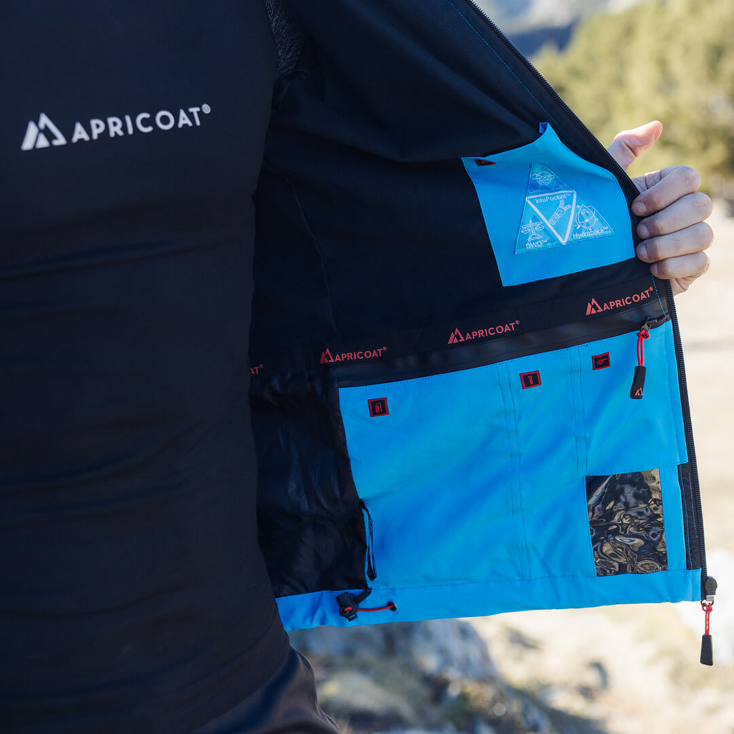 Men's Apricoat Adventurer 2.0 Weatherproof Rain Jacket in sky blue, featuring 16 integrated pockets, built-in gloves, and made from recycled materials.