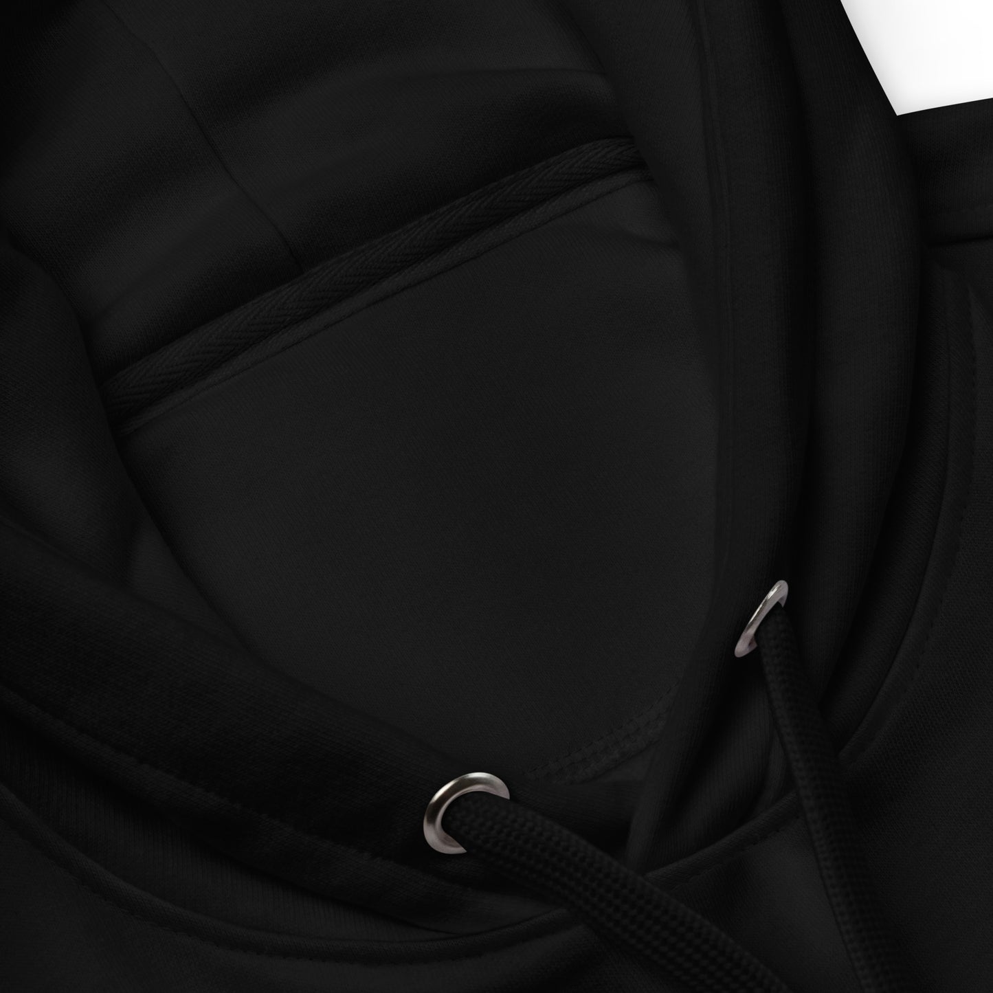 Close-up of a black jacket with a zipper and drawstring detail.