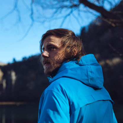 Men's Apricoat Adventurer 2.0 Weatherproof Rain Jacket in sky blue, featuring 16 integrated pockets, built-in gloves, and made from recycled materials.