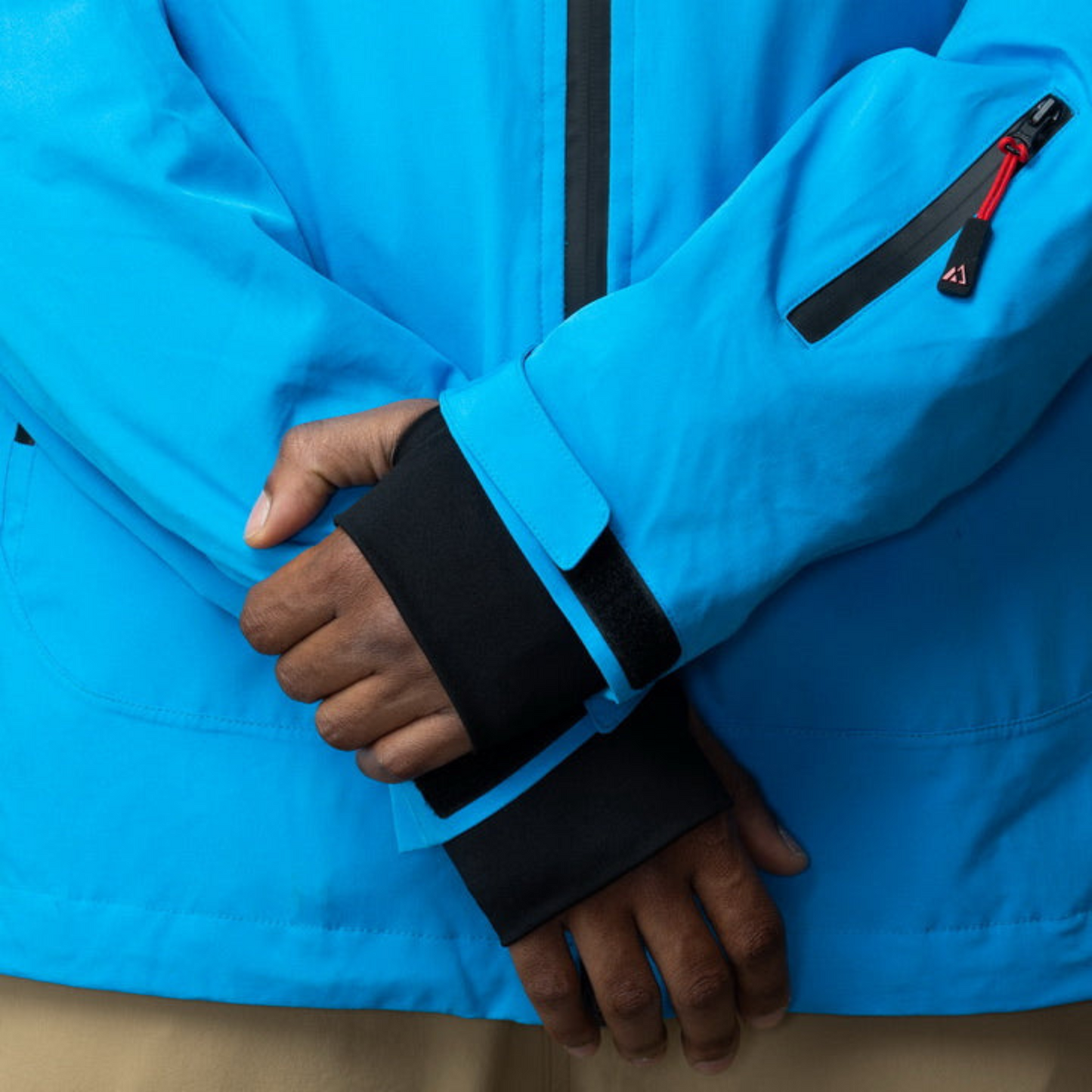 Men's Apricoat Adventurer 2.0 Weatherproof Rain Jacket in sky blue, featuring 16 integrated pockets, built-in gloves, and made from recycled materials.