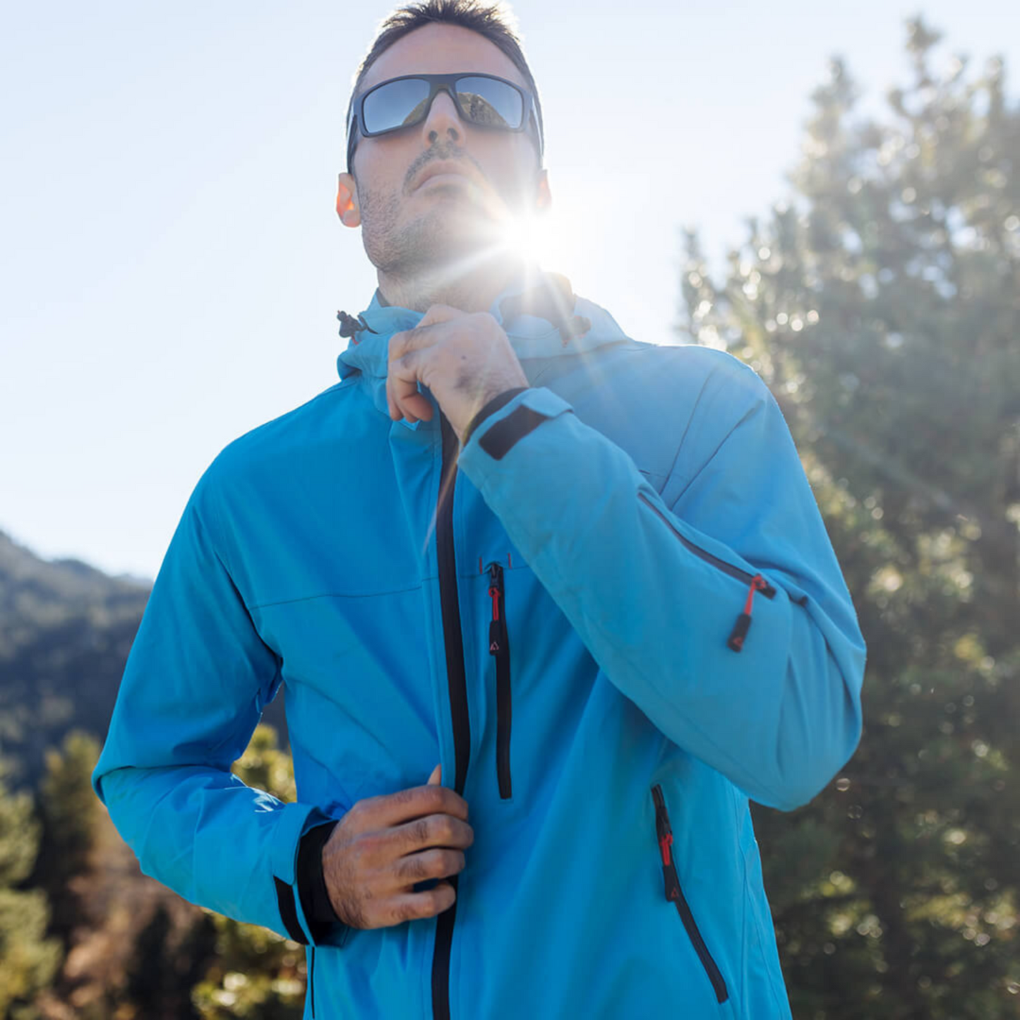 Men's Apricoat Adventurer 2.0 Weatherproof Rain Jacket in sky blue, featuring 16 integrated pockets, built-in gloves, and made from recycled materials.
