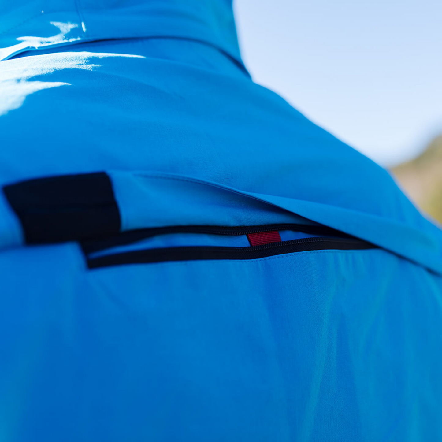 Men's Apricoat Adventurer 2.0 Weatherproof Rain Jacket in sky blue, featuring 16 integrated pockets, built-in gloves, and made from recycled materials.