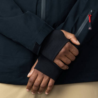 Men's Apricoat Adventurer 2.0 Weatherproof Rain Jacket in Black, featuring 16 integrated pockets, waterproof and windproof design, and built-in gloves for outdoor adventurers.