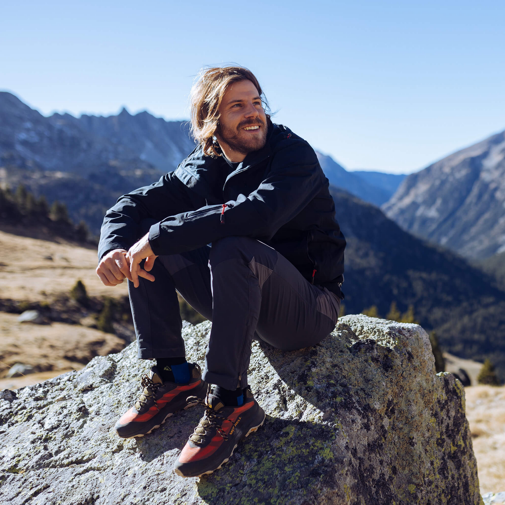 Men's Apricoat Adventurer 2.0 Weatherproof Rain Jacket in Black, featuring 16 integrated pockets, waterproof and windproof design, and built-in gloves for outdoor adventurers.