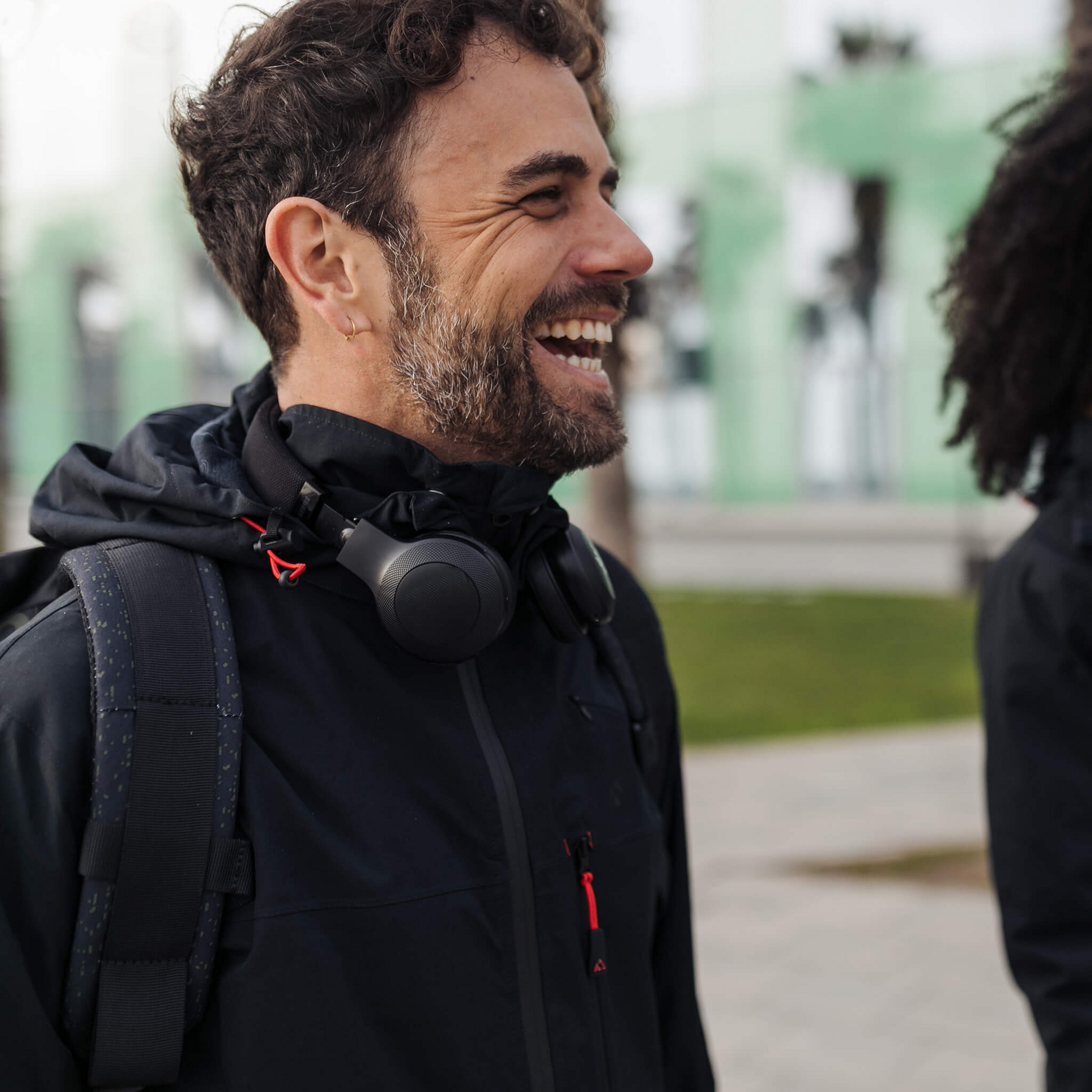 Men's Apricoat Adventurer 2.0 Weatherproof Rain Jacket in Black, featuring 16 integrated pockets, waterproof and windproof design, and built-in gloves for outdoor adventurers.