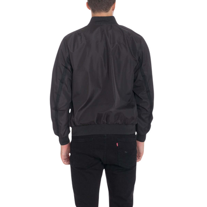 Men's black waterproof windbreaker jacket with full front zipper, ribbed cuffs, and multiple utility pockets.