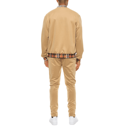 Men's two-piece Version Couture track suit with zip-up jacket and matching pants, featuring checkered detail on the collar, cuffs, and waistband.