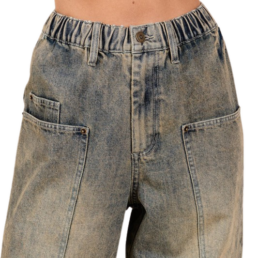 Upgrade your wardrobe with Women's Dirty Denim Wide Leg Jeans by Mitto. Featuring a flattering wide leg cut, stretchy waist, and functional pockets, these jeans offer vintage charm and modern comfort.