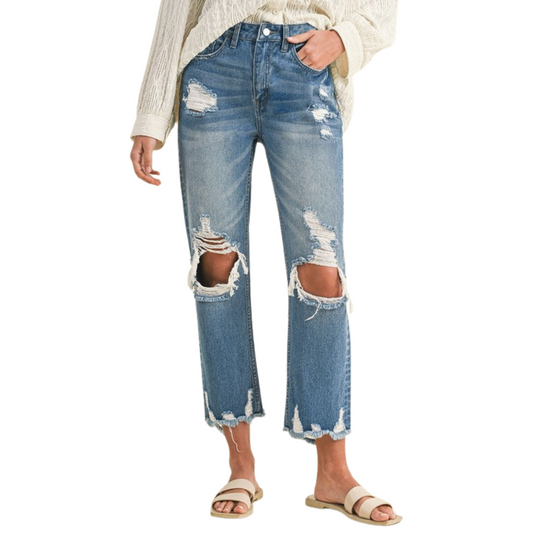 Women's Distressed Denim Cropped and Whiskered Jeans by Annie with raw hem and vintage detailing for a stylish, casual look. Available in sizes Small to Extra Large