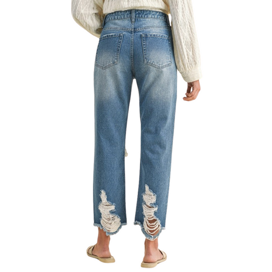 Women's Distressed Denim Cropped and Whiskered Jeans by Annie with raw hem and vintage detailing for a stylish, casual look. Available in sizes Small to Extra Large