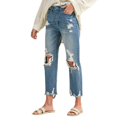 Women's Distressed Denim Cropped and Whiskered Jeans by Annie with raw hem and vintage detailing for a stylish, casual look. Available in sizes Small to Extra Large