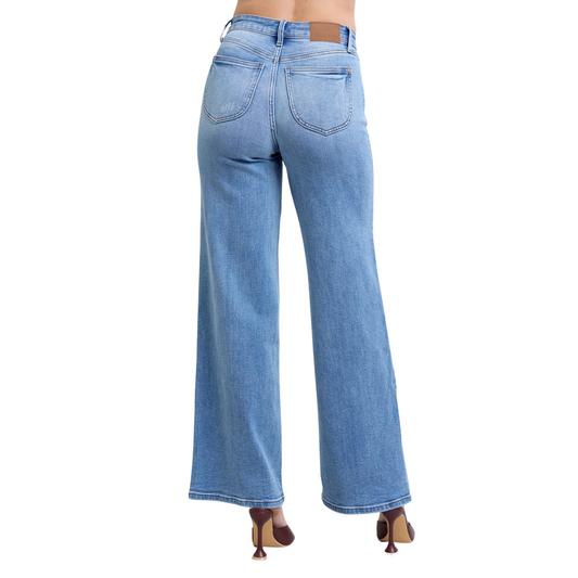 Women’s High Rise Flare Bottom Judy Blue Denim Jeans with wide-leg silhouette, high-rise waist, and front and back pockets in light-washed denim.