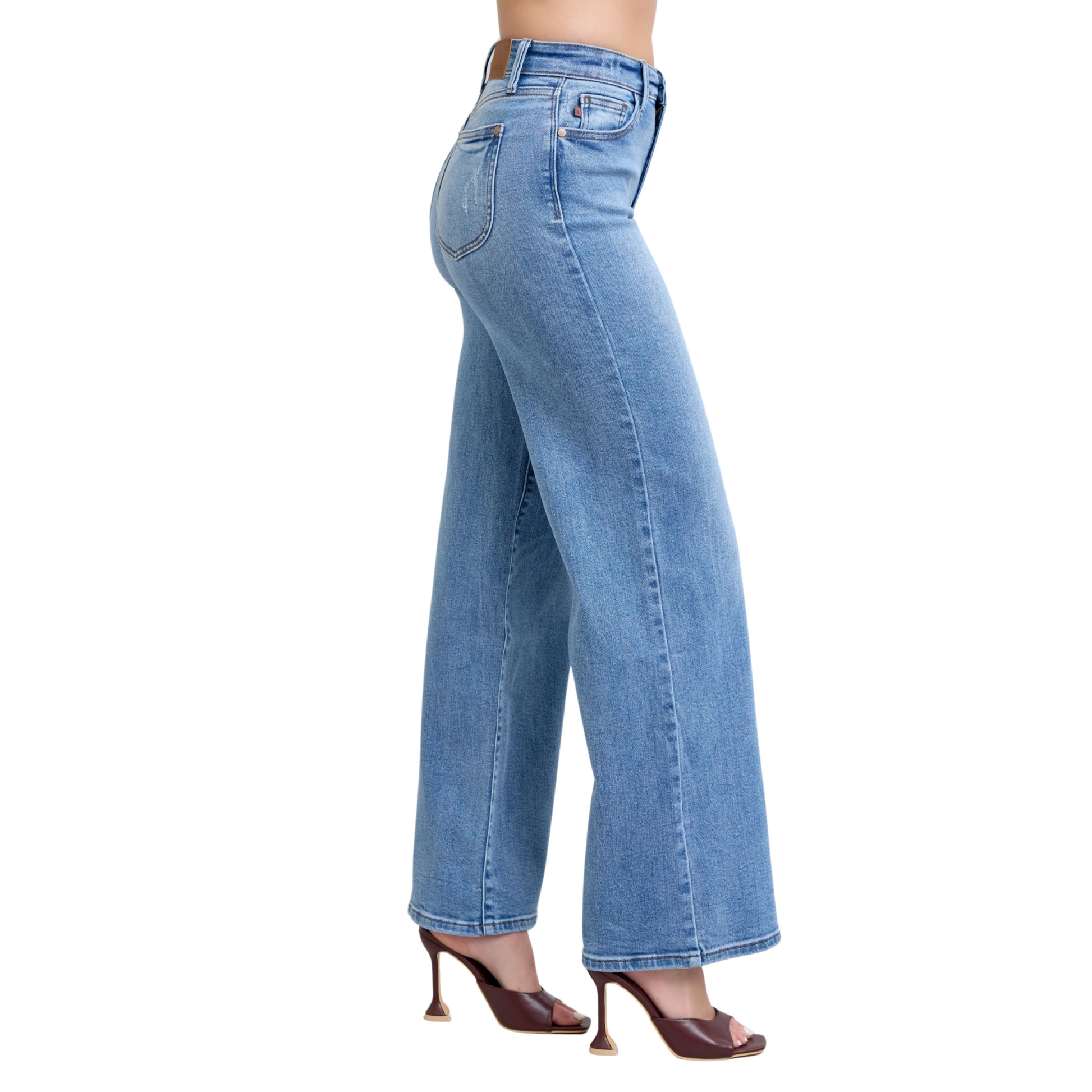 Women’s High Rise Flare Bottom Judy Blue Denim Jeans with wide-leg silhouette, high-rise waist, and front and back pockets in light-washed denim.